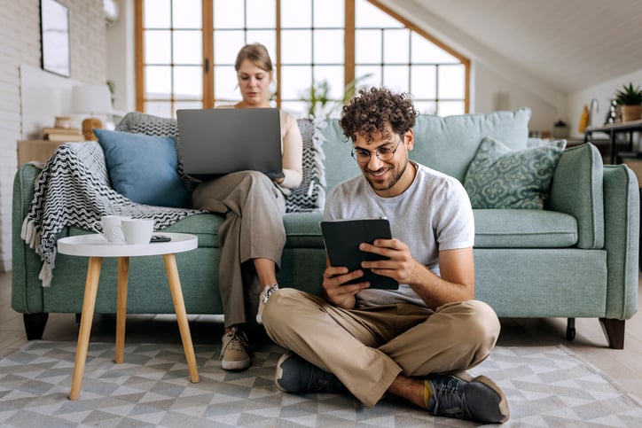 Young couple enjoying Wi-Fi