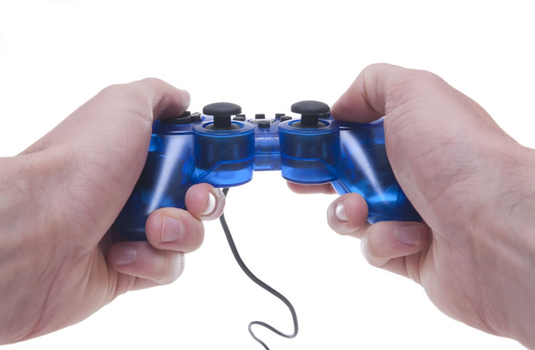 incognito-software-hand-holding-videogame-controller