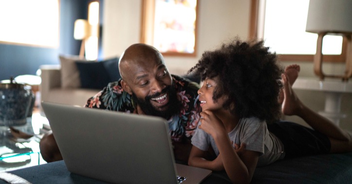 Father and daughter watching movie