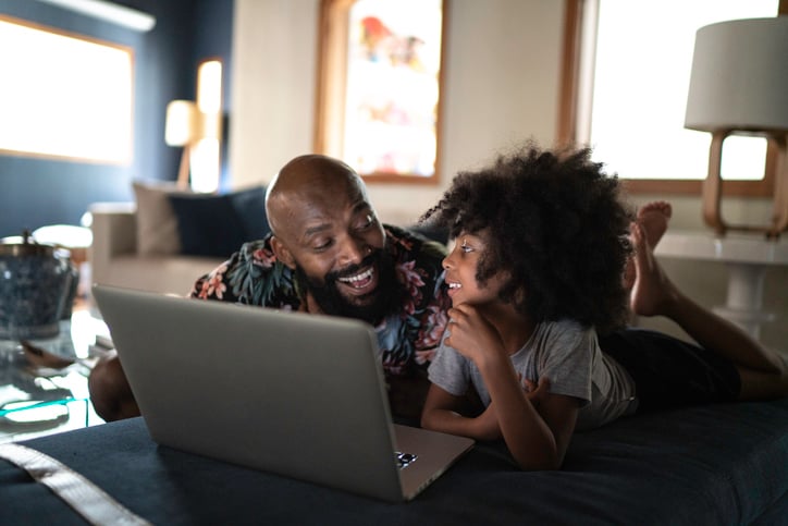 Father and daughter watching movie