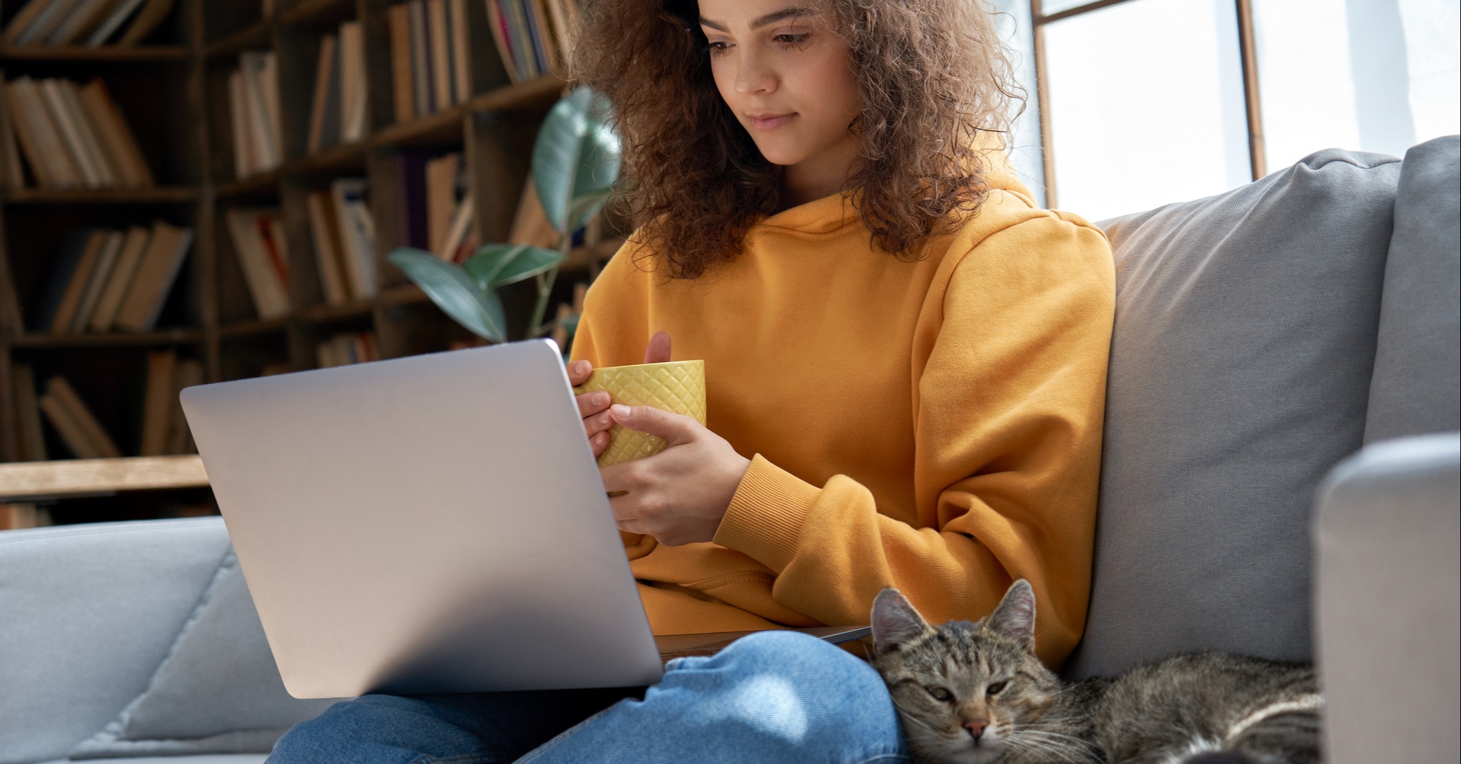 Girl with cat on laptop