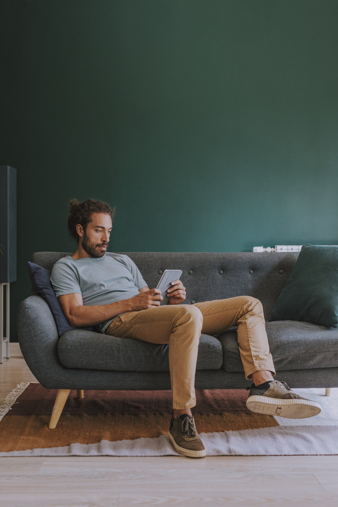 Man Using Tablet at Home