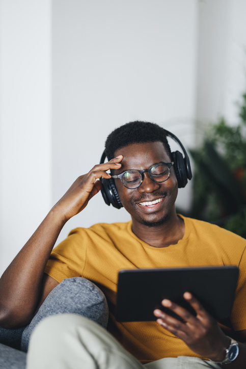 Smiling man using tablet